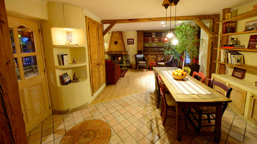 Large dining room, with entrance on the left and living room at the back